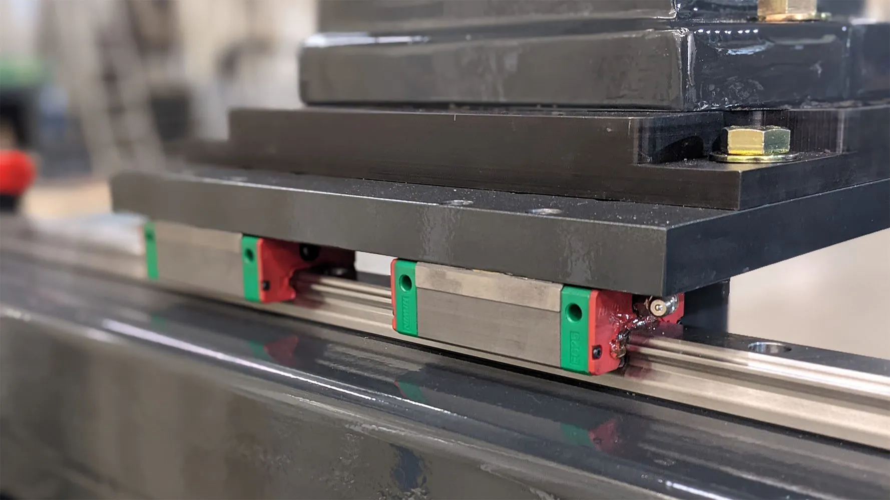 Precision linear guideway rails on the PB-L500 crankshaft balancing machine traverse system