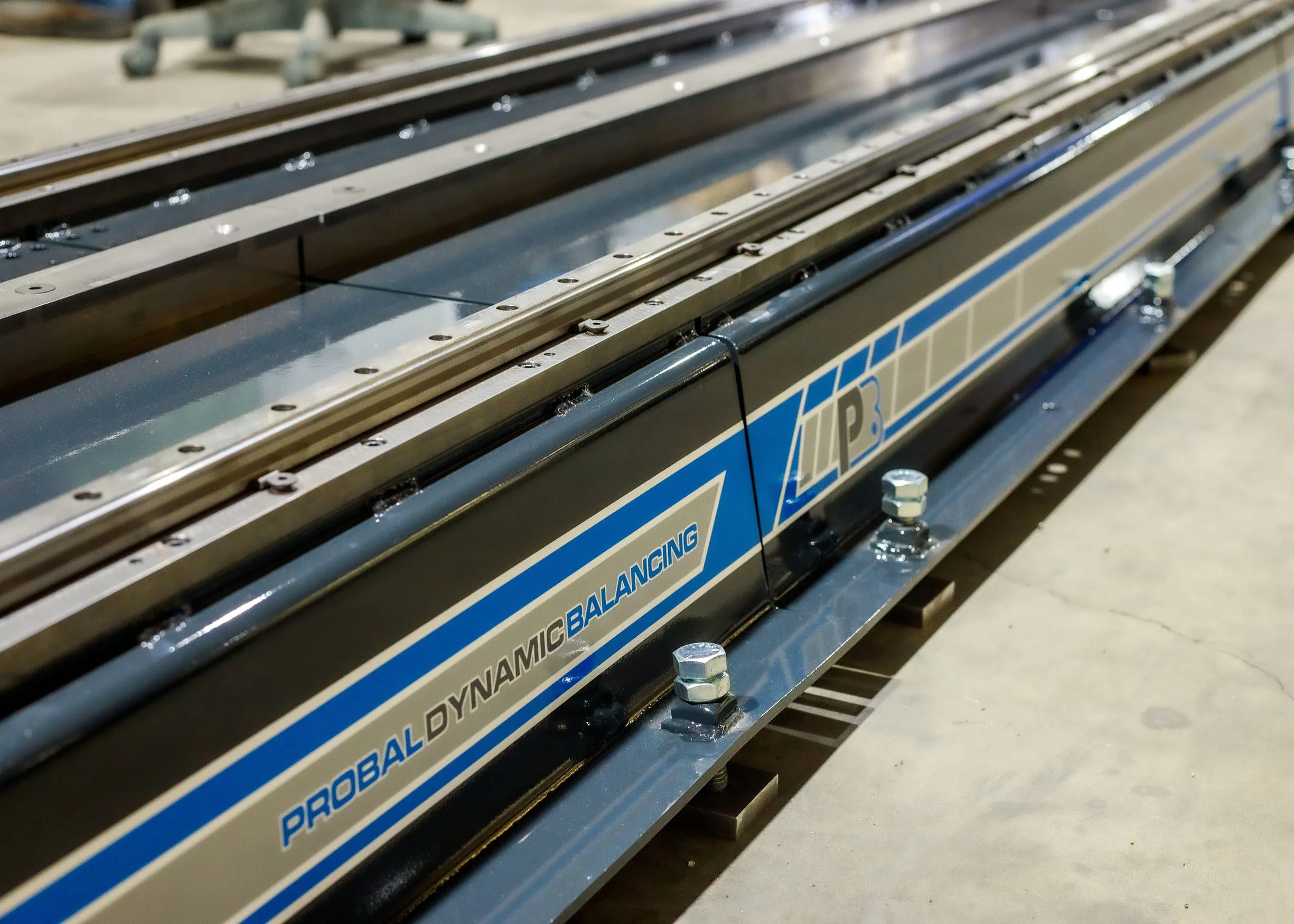 Modular base extensions with linear guideway rails on a ProBal auger balancing machine