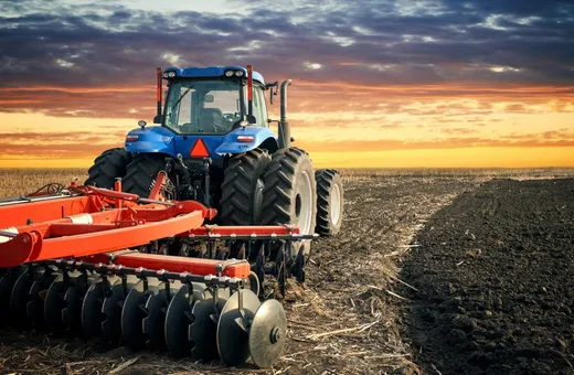 Agricultural farm machinery in a field